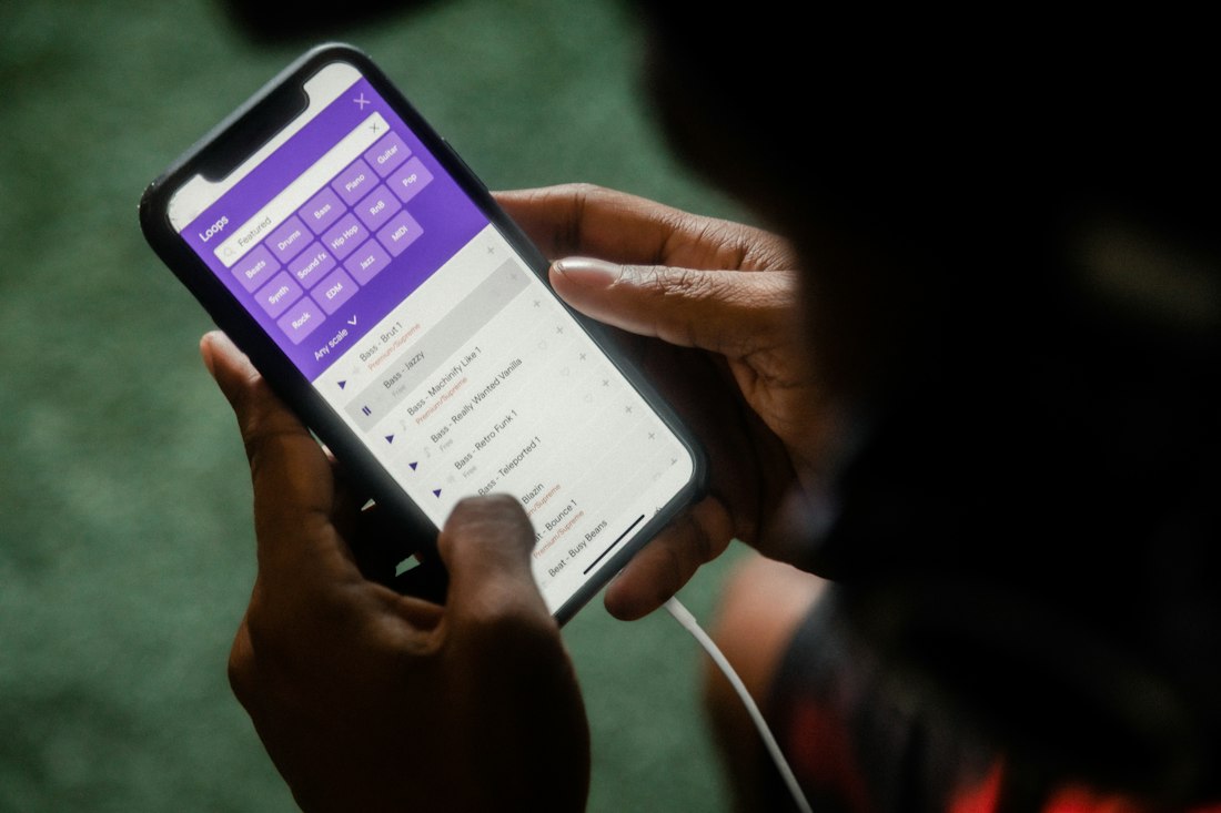 Hands holding a phone showing a calendar